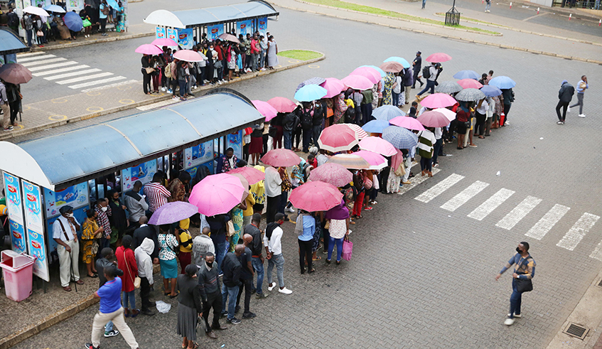 Passengers on queues await buses at Kigaliâ€™s main bus terminal on the evening of Monday, February 8. / Photos: Craish Bahizi.