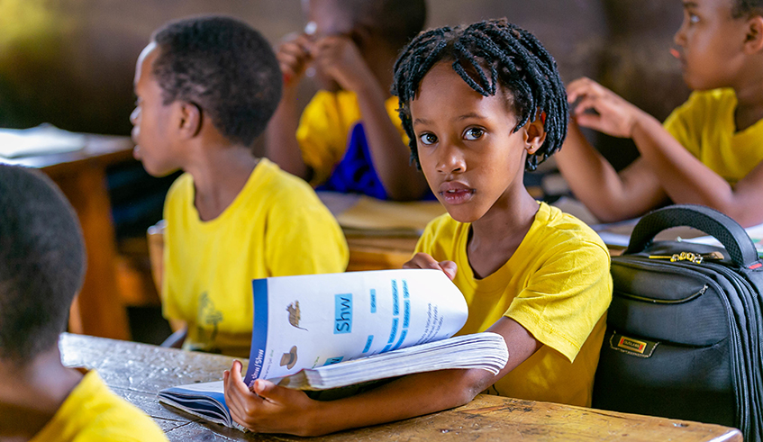 Students learn to read at Groupe Scolaire Camp Kigali before the pandemic. / Photo: Sam Ngendahimana.