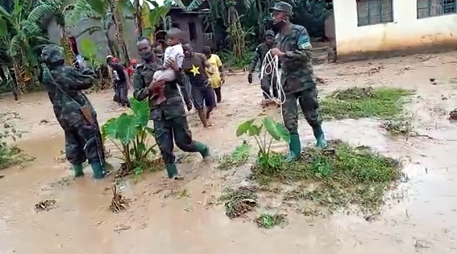 Members of the Rwanda Defence Force rescue some of the residents affected by flooding caused by Sebeya River in Rubavu District on February 10. 