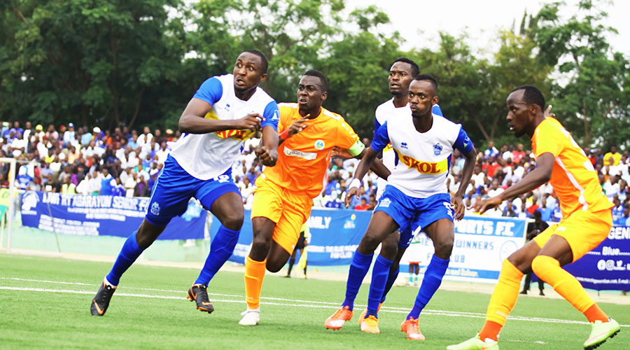 Rayon Sports and AS Kigali players during a league match last season at Kigali Stadium. The Rwanda premier league is expected to resume next month. 