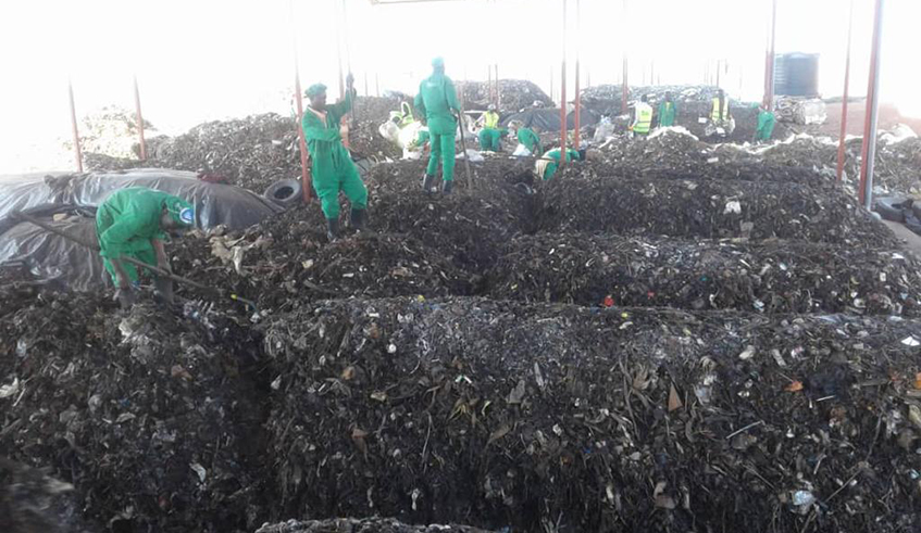 Some of the employees sorting out plastics and sachets from wastes at their firm in Huye.