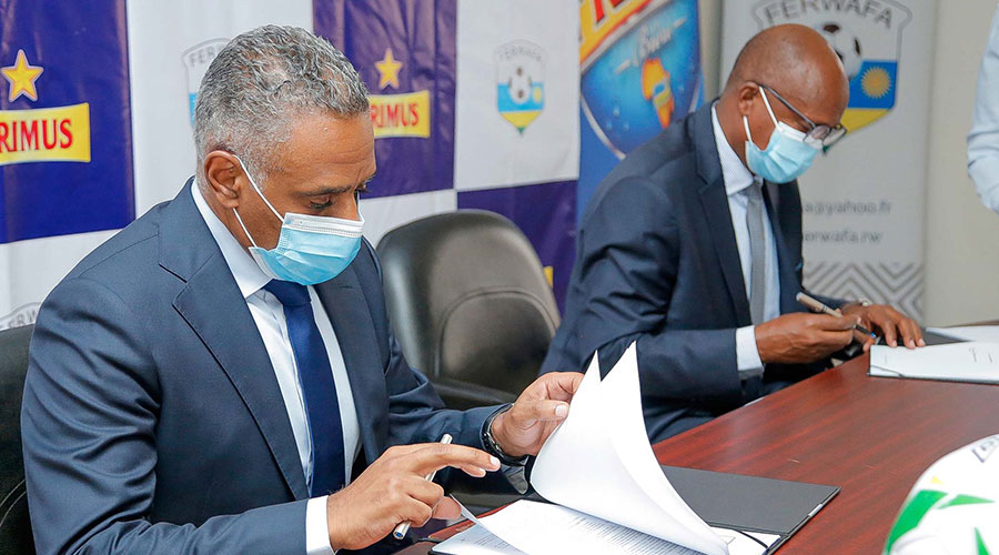 (L-R) FERWAFA President Brig. Gen Jean-Damascene Sekamana and Bralirwa Managing Director, Merid Demissie  sign the sponsorship deal on March 3. 