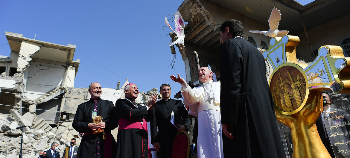 Pope Francis releases a dove representing peace at the ruins of the Syriac Catholic Church of the Immaculate Conception in Mosul, Iraq.