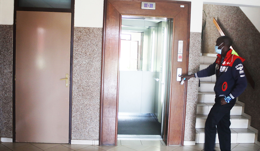 A man uses an elevator in an apartment building at Kacyiru in Kigali on Sunday, March 14. / Photo: Craish Bahizi.