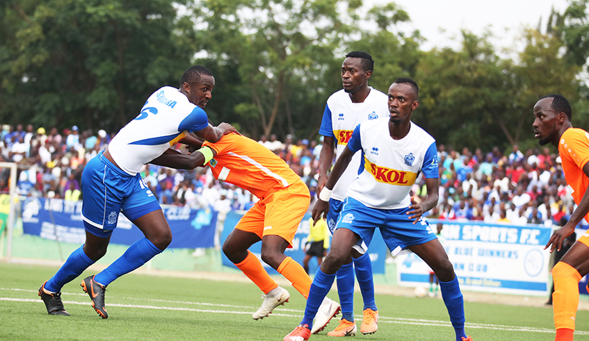 Rayon Sports and AS Kigali players battle for the ball during a past league match at Kigali stadium. The national football governing body, Ferwafa is considering changing this yearu2019s league into a tournament competition. / Photo: Sam Ngendahimana.