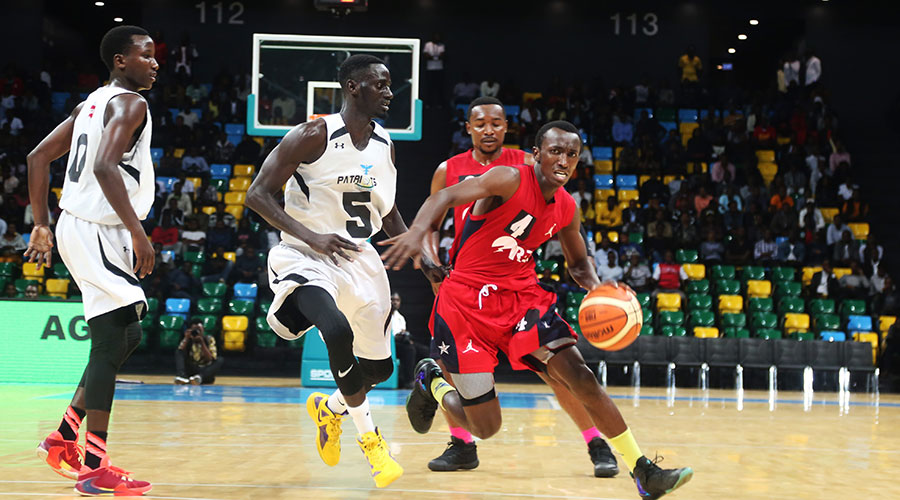 Nshobozwabyosenumukiza (with the ball) during a previous league match against Patriots at Kigali Arena. The 22-year-old set a world record for steals in the Afrobasket tourney last month. 