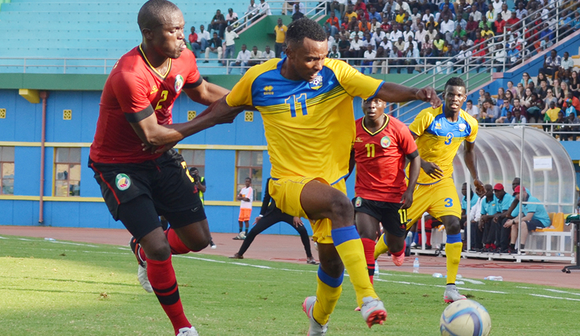 Amavubi winger Xavio Dominique Nshuti goes past a Mozambique defender at Amahoro Stadium in a past match. / Photo: Sam Ngendahimana.