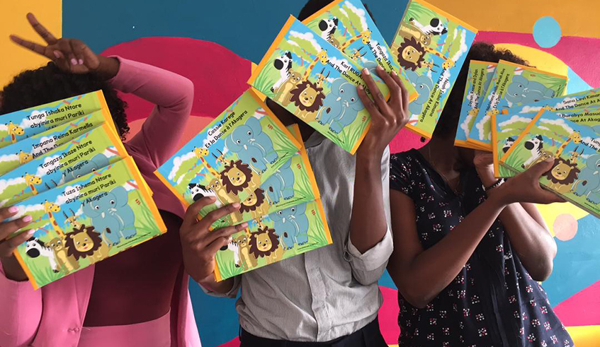 Children holding the baby books. / Courtesy