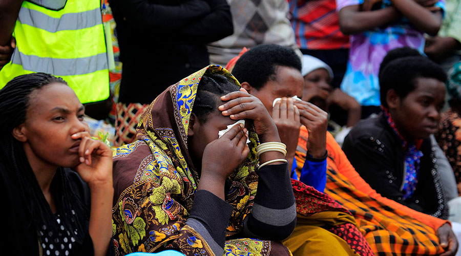 Mourners listen to a genocide survivor giving testimony during a commemoration event at Murambi Genocide Memorial in 2017. The uncertainty surrounding the Covid-19 outbreak has heightened mental health problems among the survivor community. 