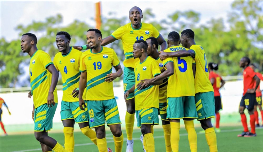 Rwandan players celebrate after beating Mozambique at Kigali Stadium on Wednesday, March 24. Striker Lague Byiringiro (L) scored the lone goal of the match. / Courtesy