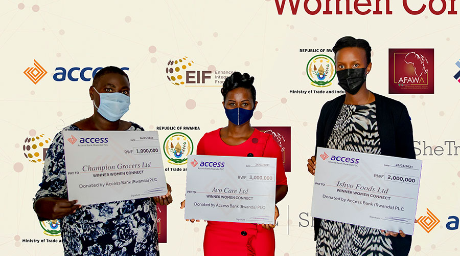Women representatives of winning SMEs pose in a photo with their dummy cheques. 