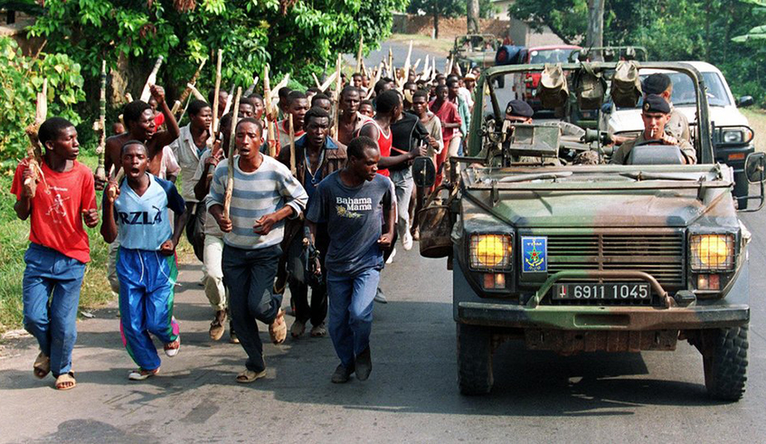 Members of the Interahamwe militia run alongside trucks carrying French troops during the Genocide against the Tutsi in this picture that is part of the documentation at Murambi Genocide Memorial in Nyamagabe District. / Photo: File.