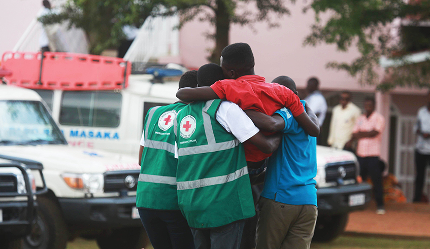 Red Cross volunteers help a trauma victim at Kicukiro Nyanza Genocide Memorial May 4, 2019 . / Sam Ngendahimana