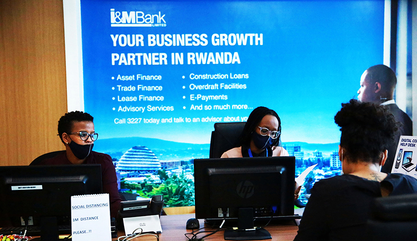 Help desk staff attend to a client at I&M Bank Kimihurura branch. / Photo: Sam Ngendahimana.