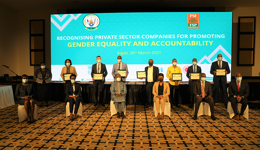 Officials pose with the recongonised  private companies that have promoted gender equality. The event took place at Serena Hotel on March 30 . / Craish Bahizi