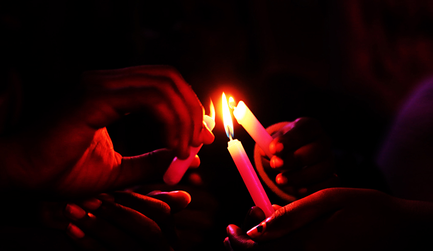Mourners light candles during a commemoration event at the Kigali Genocide Memorial in 2019. Like 2020, this year, the commemoration week will be impacted by a number of changes. / Photo: Sam Ngendahimana.