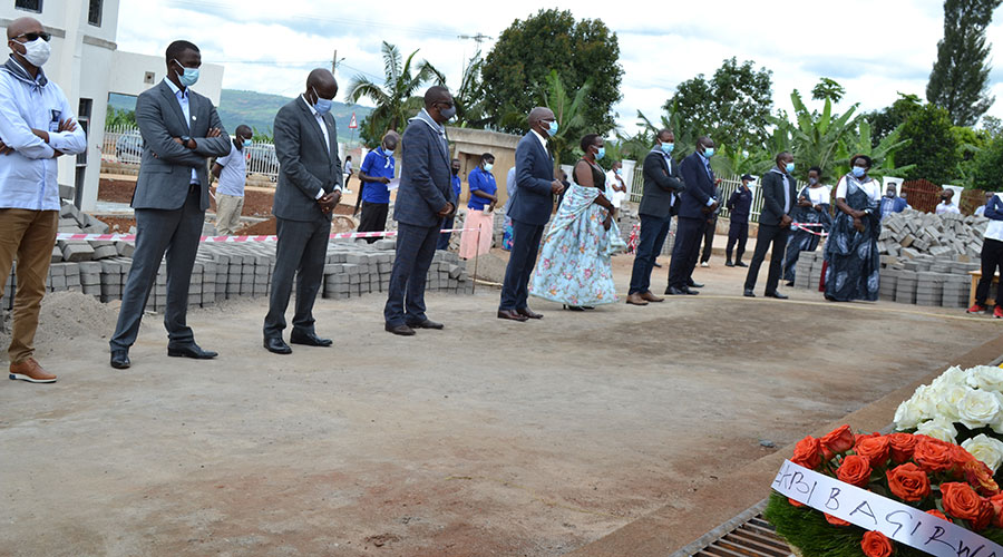Mourners observe a moment of silence to pay tributes to more than 14,000 victims of Genocide against Tutsi in 1994 laid to rest in Kiziguro Genocide memorial on Sunday April 11. 