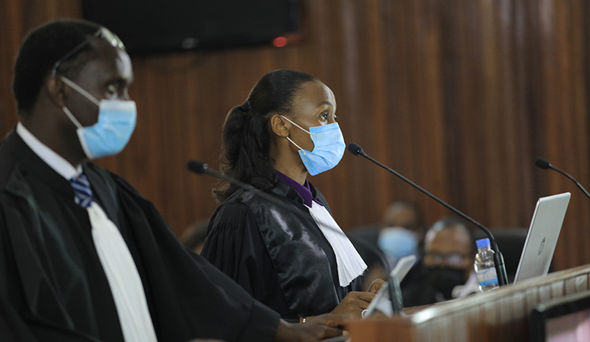 Prosecutors Bonaventure Ruberwa (left) and Claudine Dushimimana during a substantive trial of Paul Rusesabagina and 20 others with whom he is co-accused of perpetrating terror activities on Rwandan soil. The trial was held at the High Court Special Chamber for International and Cross-border Crimes in Kigali on Wednesday, April 21. / Photo: Sam Ngendahimana.