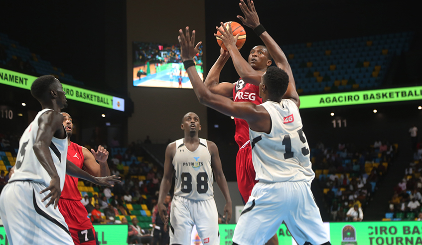 REG's Elie Kaje takes a throw in during a match against Patriots at Kigali Arena in 2019. REG are favourites to win this year's pre-season tourney. / Sam Ngendahimana. 