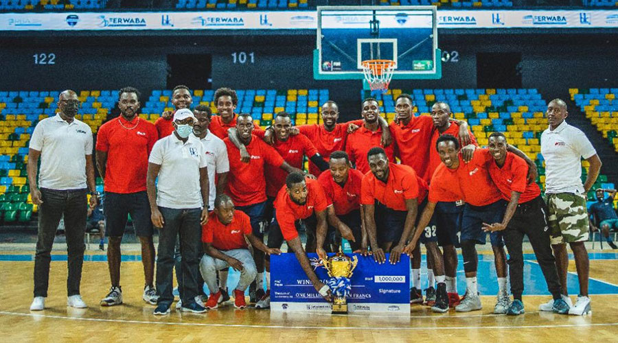 REG Basketball players and officials pose for a group photo after winning the annual pre-season trophy. 
