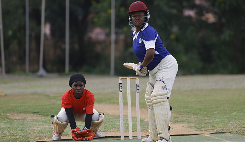 OASIS cricket clubu2019s Rachel Ntono during a previous match against White Clouds at Kicukiro oval. Rwanda is ranked 7th in Africa in women cricket. / Sam Ngendahimana.