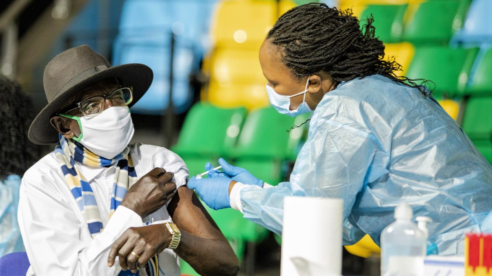 An elderly man receives his first dose of Covid-19 vaccine at Kigali Arena last month. 