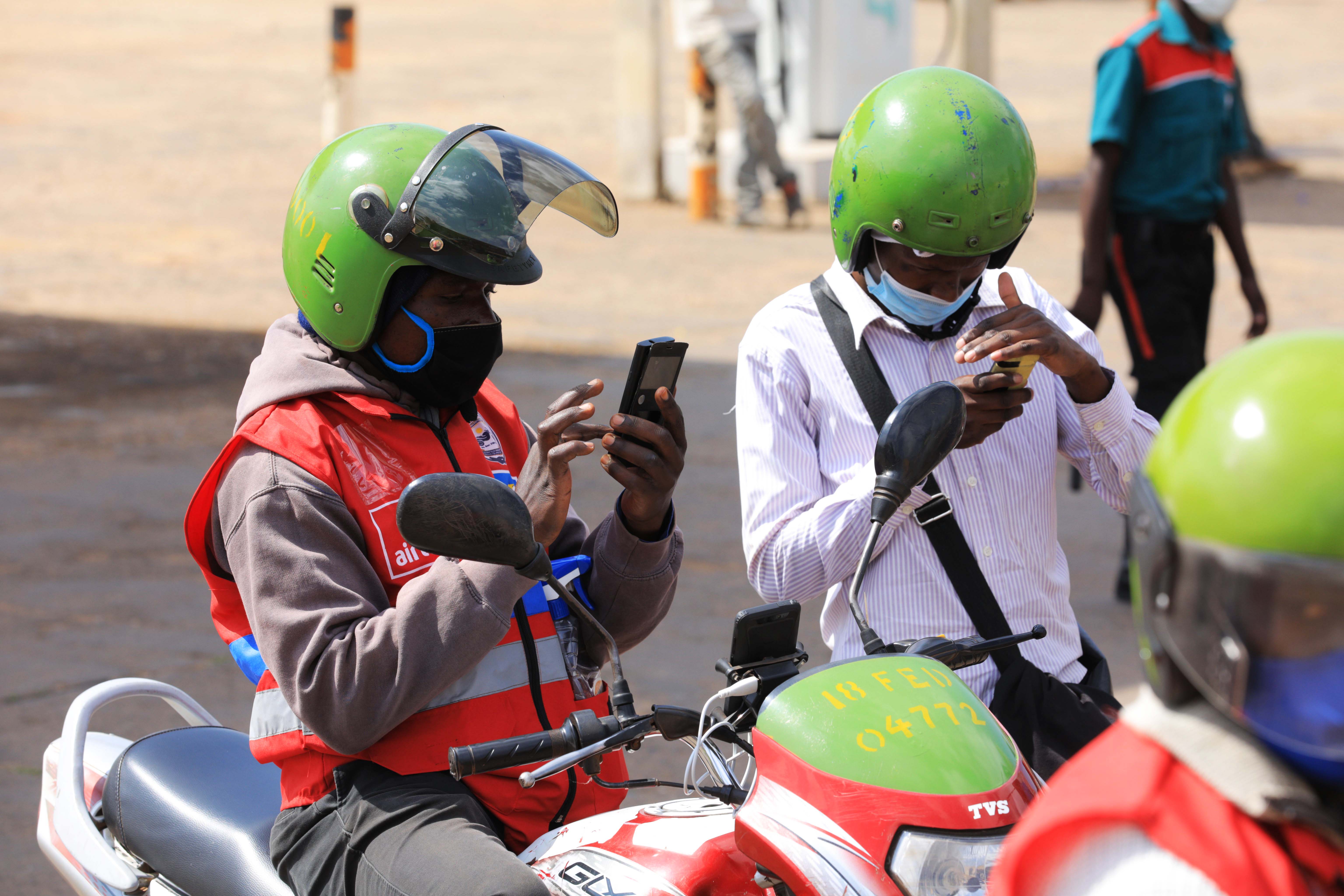 A passenger using mobile money to pay for his ride on a taxi moto in Kigali. The discrepancies in costs to pull money from oneu2019s bank account to their mobile money wallet threatens to set the country back on gains made towards cashless payments. A passenger using mobile money to pay for his ride on a taxi moto in Kigali. The discrepancies in costs to pull money from oneu2019s bank account to their mobile money wallet threatens to set the country back on gains made towards cashless payments.