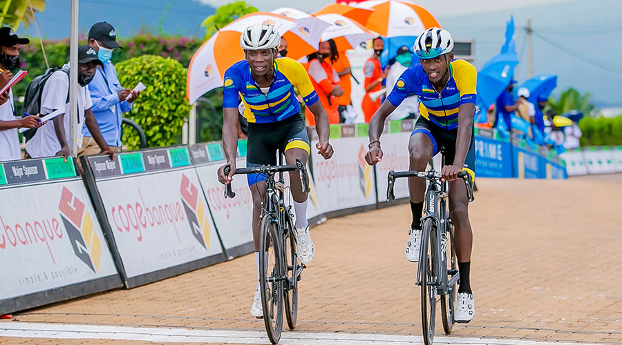 Former Tour du Rwanda winners Jean-Bosco Nsengimana and Samuel Mugisha cross the finish line of Tour du Rwanda 2021 at Rebero on May 9. Rwandan riders performed poorly this year. 