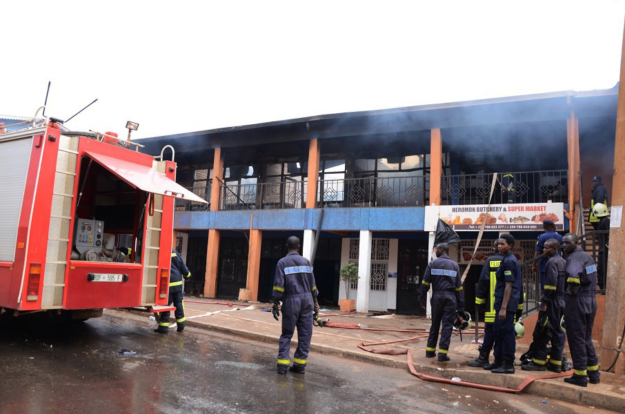 Rwanda National Police's fire brigade policemen at work in Nyabugogo when a commercial building caught on fire. 