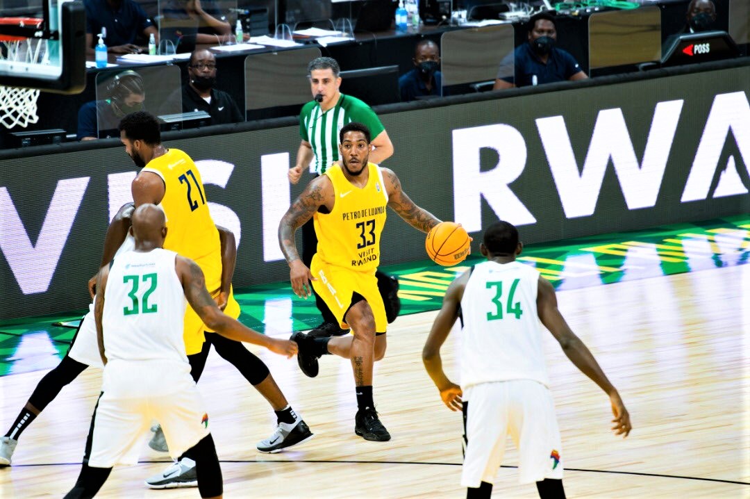 Petro de Luanda secured their quarter-final slot after overcoming Cameroon's FAP 66-64 in Group B at Kigali Arena on Thursday. 