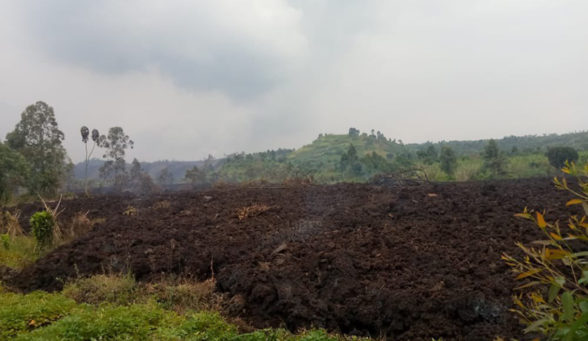 Lava deposited by the eruption of Mount Nyiragongo volcano in neighbouring DR Congo over the weekend is seen in one of the destroyed farms in Cyanzarwe Sector in Rubavu District. / Photo: Mou00efse Bahati.