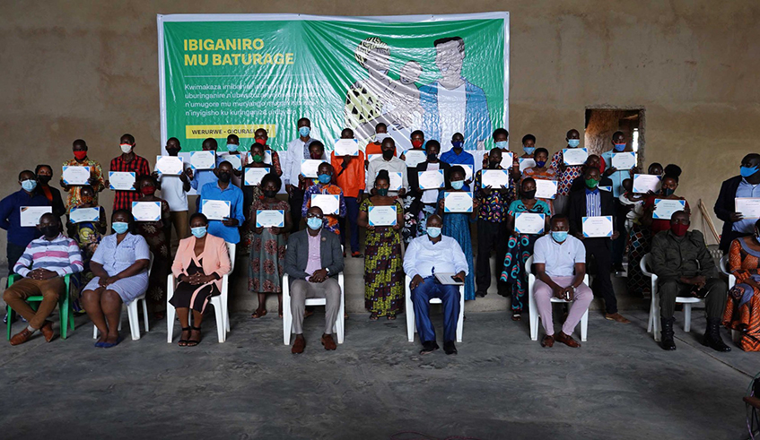Participants hold certificates in a group photo with officials at the conclusion of a training on sexual and gender-based violence organised by HDI and Tear Fund. / Photo: Courtesy.