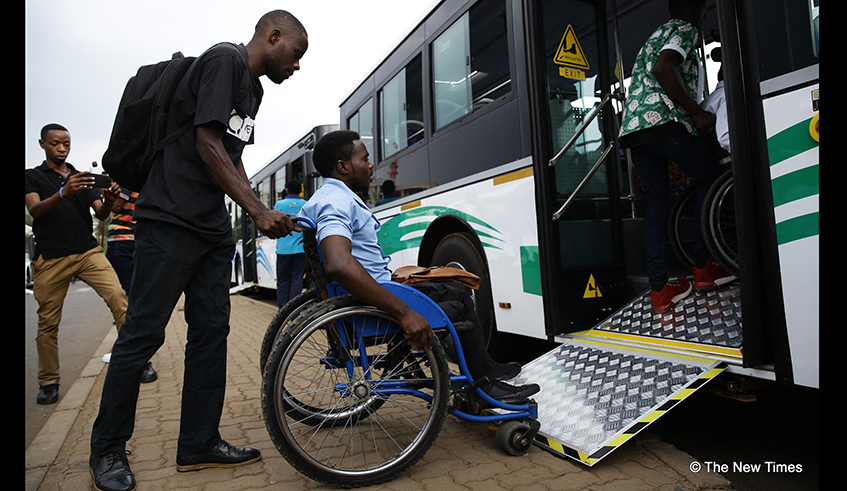 A man with a walking disability is helped on a bus using a special ramp fitted for people with disabilities to access public transport. The new policy has been welcomed with several stakeholders saying it will increase inclusivity. / Photo: File.