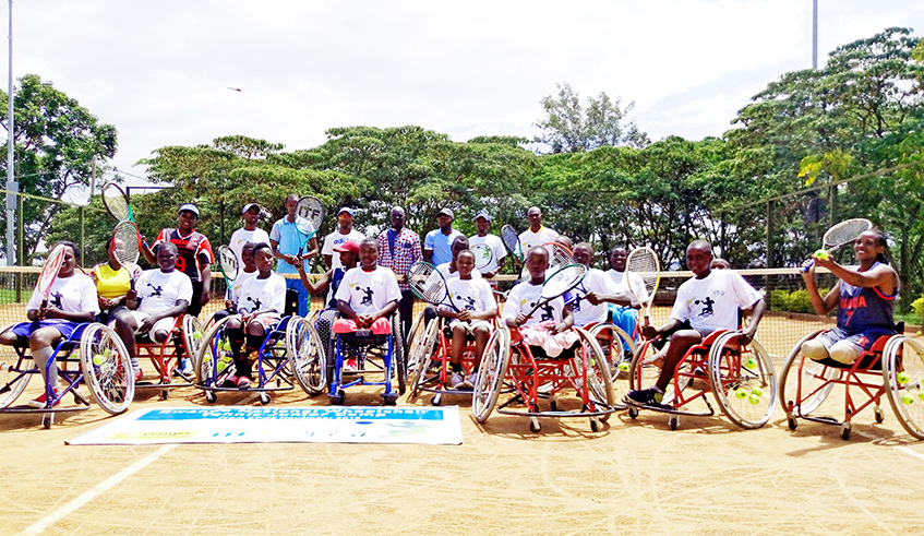 Children with disabilities who play for the Rwanda wheelchair tennis team pose for a photo at Amahoro National Stadium tennis court in 2019. / Photo: Sam Ngendahimana.