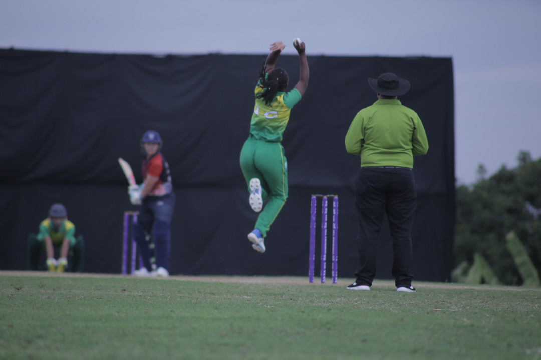 Henriette Ishimwe up in the air before bowling during the match against Namibia. 