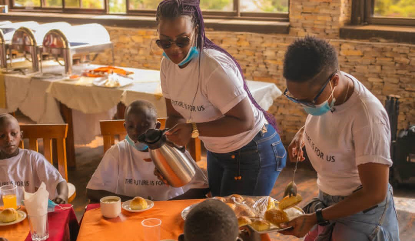 Young Grace and Nana (top) and Loris (right) serving food and drinks to the children from vulnerable homes. / Courtesy photos.