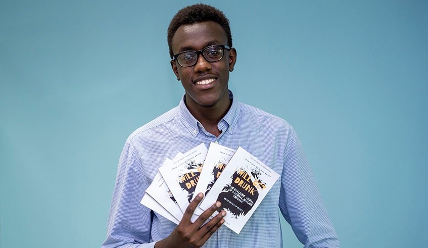 Patrick Shyaka with his book during the interview.  Photos/Olivier Mugwiza