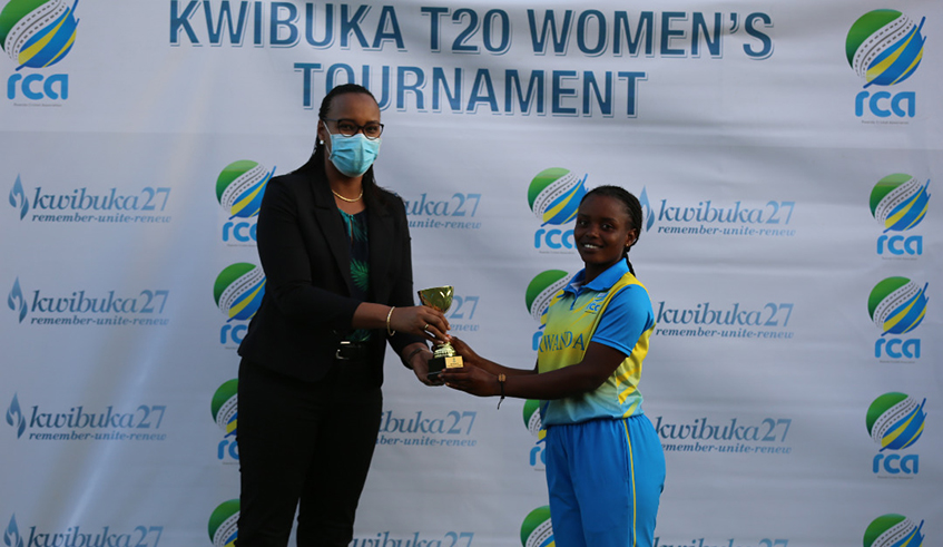 Rwanda's Henriette Ishimwe (R) receives the Player of Match award from Sports Minister Aurore Mimosa Munyangaju after a win over Nigeria on Wednesday, June 9 . / Courtesy