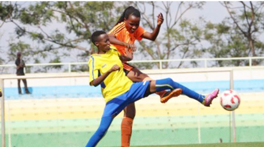 AS Kigali and Scandinavia FC players battle for the ball during a past womenu2019s league tie at Kigali Stadium. The league is slated to start next month. 