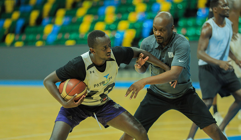 Bernard u2018Benu2019 Oluoch head coach of Patriots basketball club attack his player Sano during the training at Kigali Arena last month. / Dan Nsengiyumva.