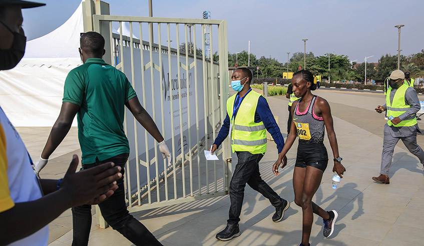 Marthe Yankurije (C) after winning a gold medal in the womenu2019s half marathon in the Kigali Peace Marathon on June 20, 2021. / Dan Nsengiyumva