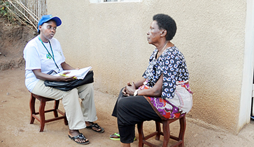 An enumerator interacts with a resident during a previous census in Kigali. / Photo: File.