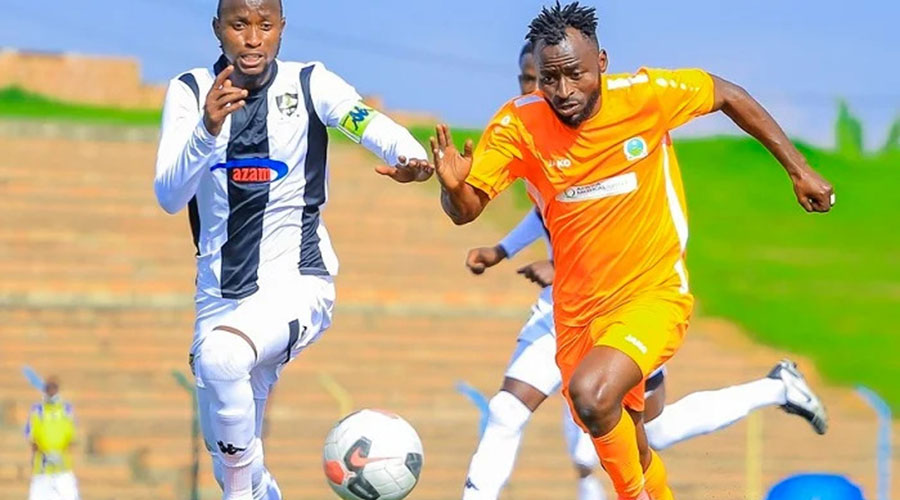 APR skipper Thierry Manzi (L) challenges AS Kigali forward Shaban u2018Tchabalalau2019 Hussein for the ball during a past league match at Bugesera Stadium. 