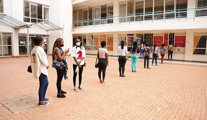 Mount Kenya University Rwanda students observe physical distancing before entering the classroom in December 2020. / Photo: Craish Bahizi.
