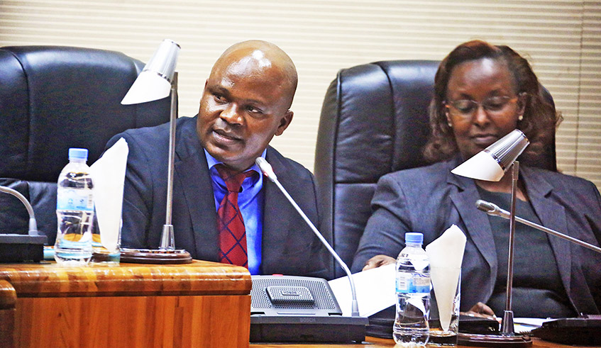 Omar Munyaneza, Chairperson of the parliamentary Standing Committee on National Budget and Patrimony (left), speaks during a session in 2019 as his deputy Francesca Tengera looks on. / Photo: File.
