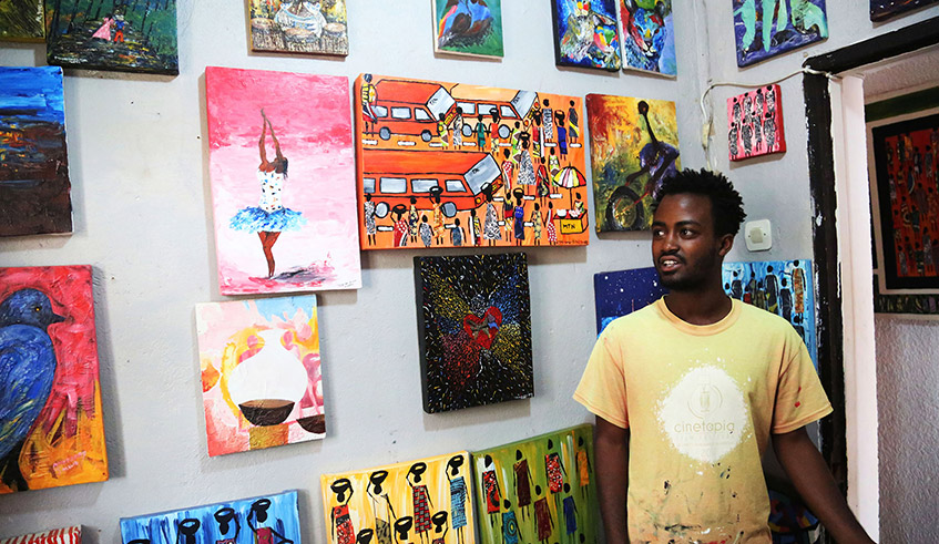 Emmanuel Mutuyimana poses with some of his artworks during an exhibition at Ivuka Arts Gallery in Kigali in 2019. / Photo: Sam Ngendahimana.
