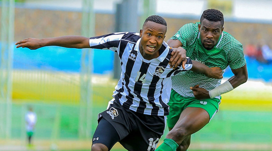 Lague Byiringiro (#14) is seen here in action during a past friendly match between APR and SC Kiyovu at Kigali Stadium. 