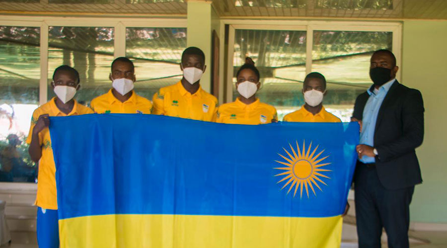 Didier Shema-Maboko, Permanent Secretary in the Ministry of Sports, with Rwandan athletes to the Tokyo Olympics on Monday. 