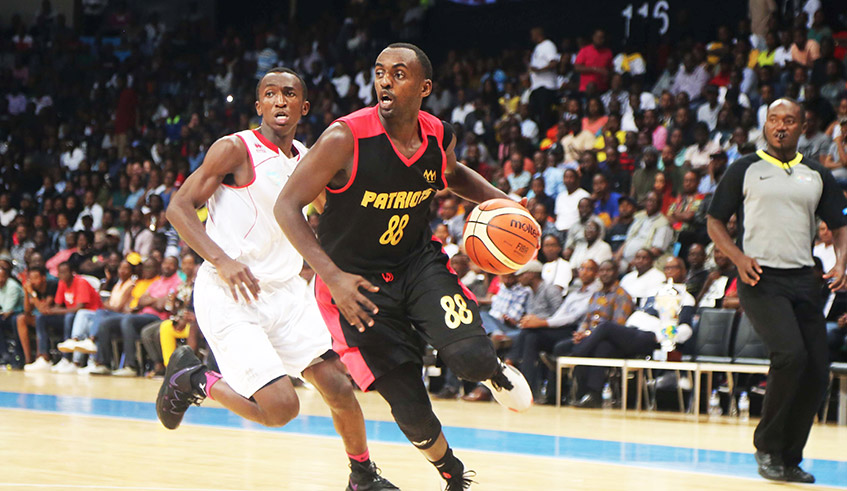 Patriots team captain Aristide Mugabe with the ball during a past league game against REG at Kigali Arena. The 33-year-old has been recalled to the national team. / Sam Ngendahimana.