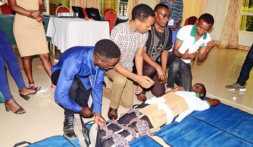 University of Rwanda student practice suturing techniques during a basic surgical skills workshop in 2019. / Photo: Courtesy.